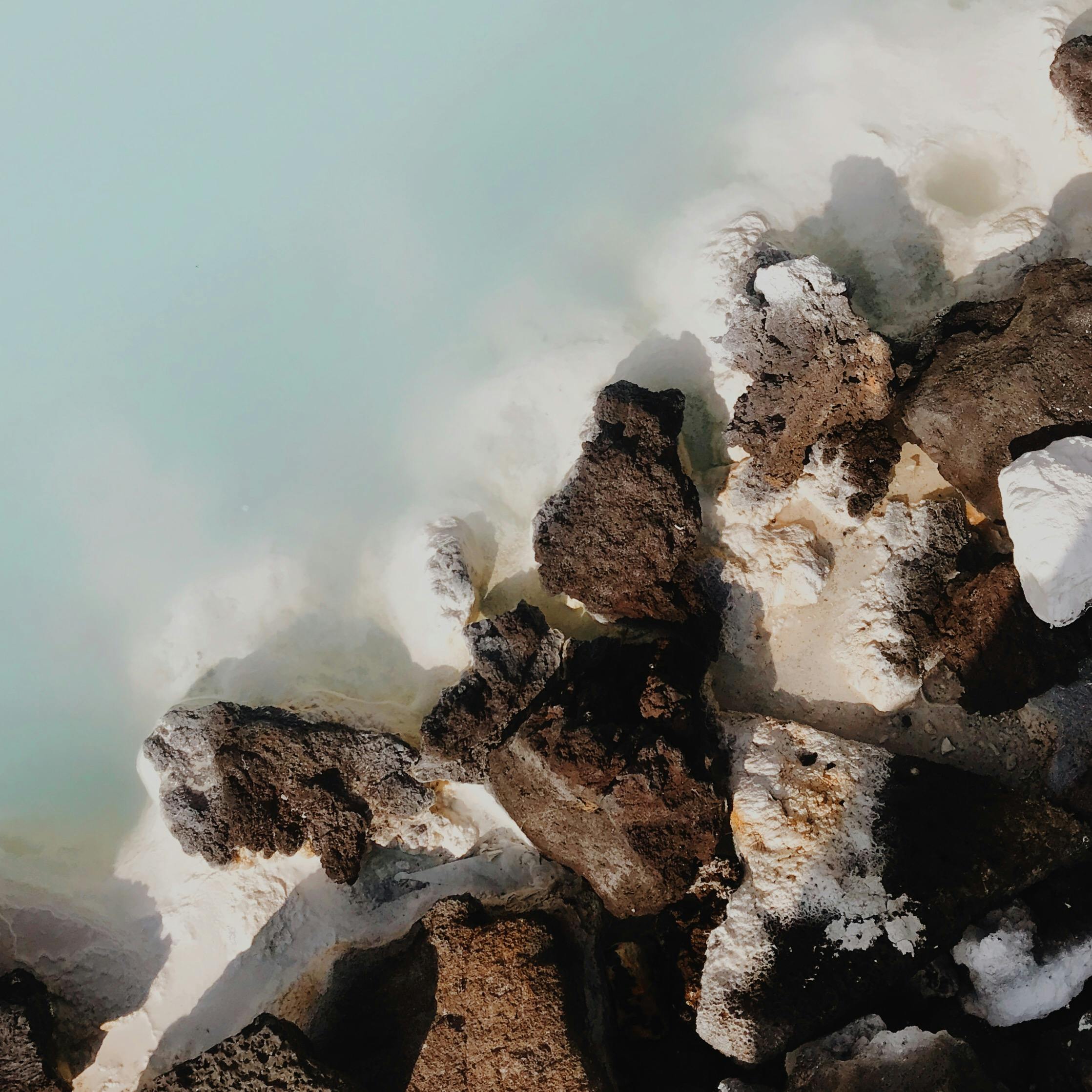 Aerial view of geothermal rocks and aqua waters at Iceland's Blue Lagoon.